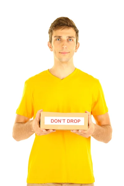 Young delivery man holding parcel, isolated on white — Stock Photo, Image