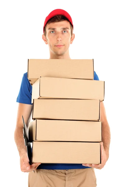 Young delivery man holding parcels, isolated on white — Stock Photo, Image