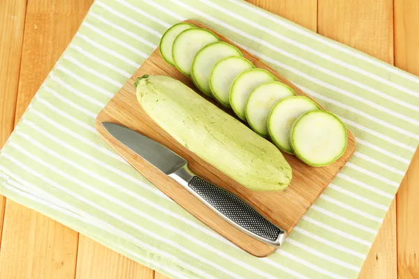 Fresh marrows on cutting board, on wooden background — Stock Photo, Image