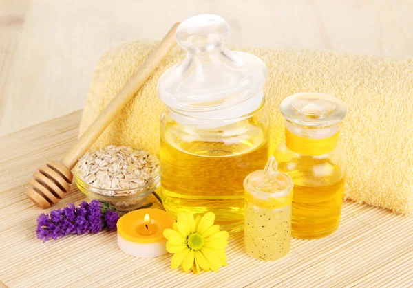 Fragrant honey spa with oils and honey on wooden table close-up — Stock Photo, Image