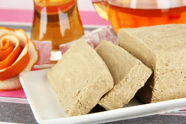 Tasty halva with tea on table close-up — Stock Photo, Image