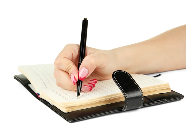 Hand signing in notebook, isolated on white — Stock Photo, Image