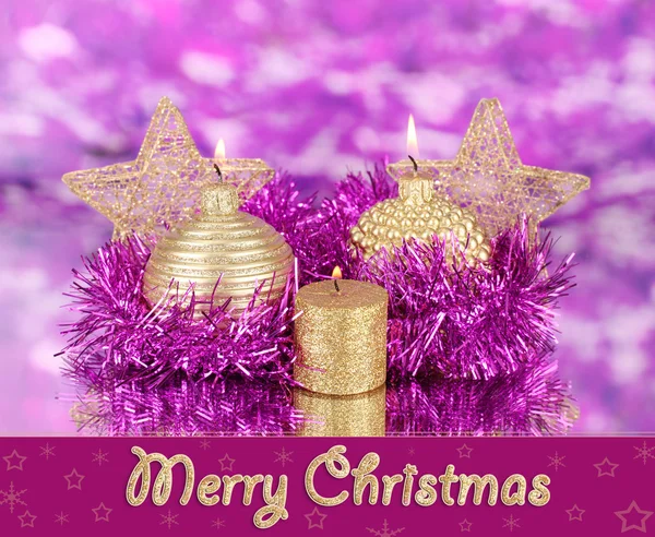 Christmas composition with candles and decorations in purple and gold colors — Stock Photo, Image