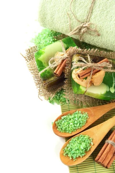 Hand-made soap and sea salt on bamboo mat, isolated on white — Stock Photo, Image