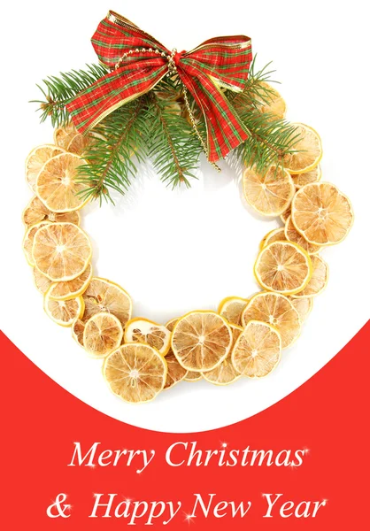 Christmas wreath of dried lemons with fir tree and bow — Stock Photo, Image
