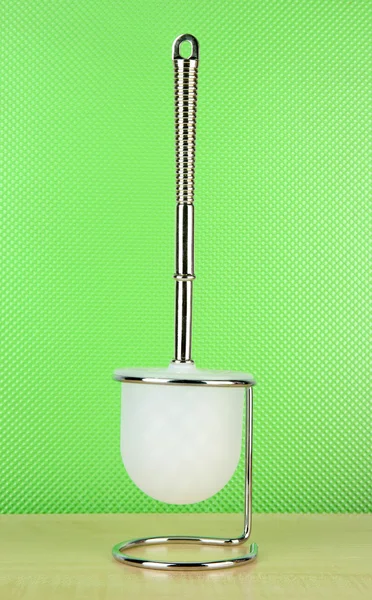 Toilet brush on green background — Stock Photo, Image