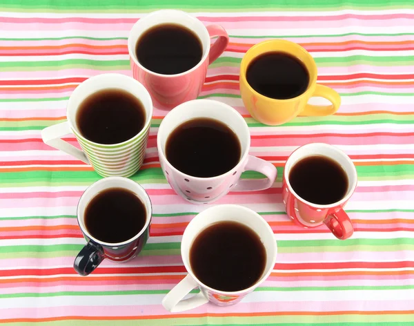 Many cups of coffee on striped napkin — Stock Photo, Image