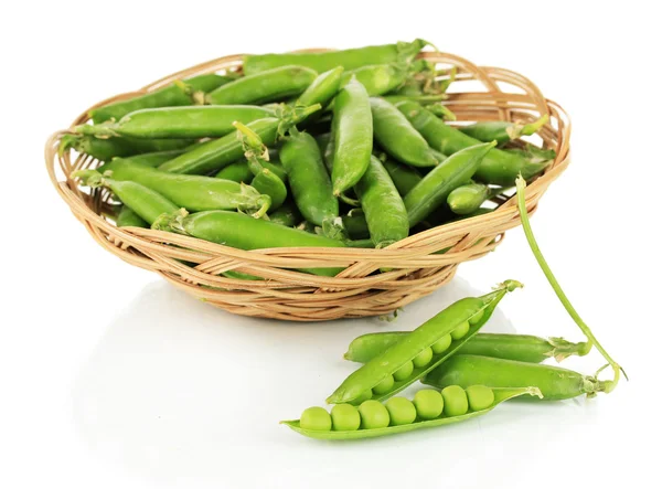 Sweet green peas in wicker basket isolated on white — Stock Photo, Image