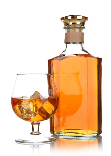 Glas brandy en fles geïsoleerd op wit — Stockfoto