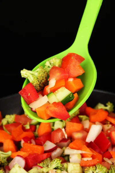 Vegetable ragout in pan, isolated on black — Stock Photo, Image