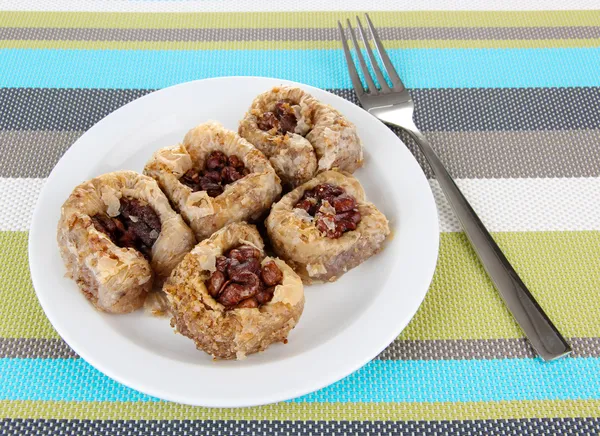 Sweet baklava on plate on table — Stock Photo, Image