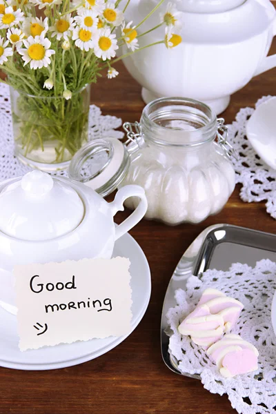 Table setting with chamomiles on wooden table — Stock Photo, Image