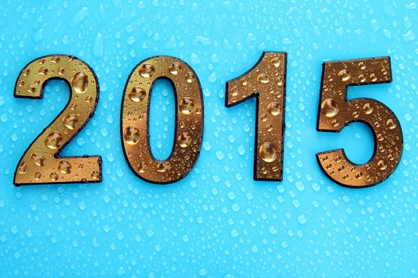 2015 in golden numbers, on blue background — Stock Photo, Image