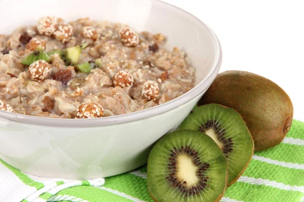 Useful oatmeal in bowl with fruit isolated on white — Stock Photo, Image