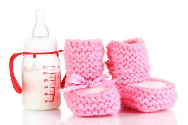 Bottle for milk formula with booties isolated on white — Stock Photo, Image