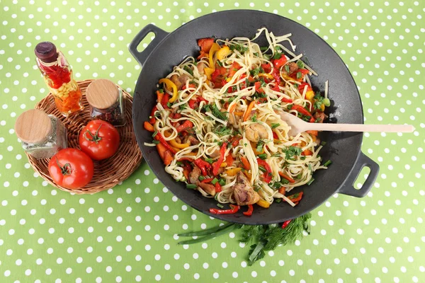Noodles with vegetables on wok on cloth background — Stock Photo, Image