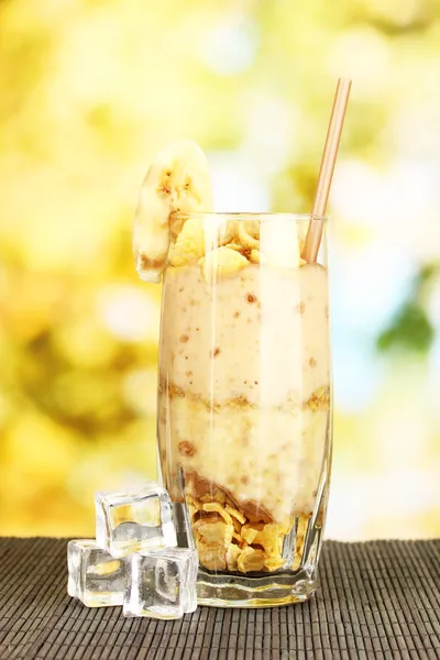 Delicious fruit smoothie on bright background — Stock Photo, Image