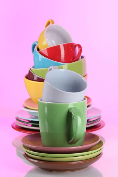 Mountain colorful dishes on pink background — Stock Photo, Image
