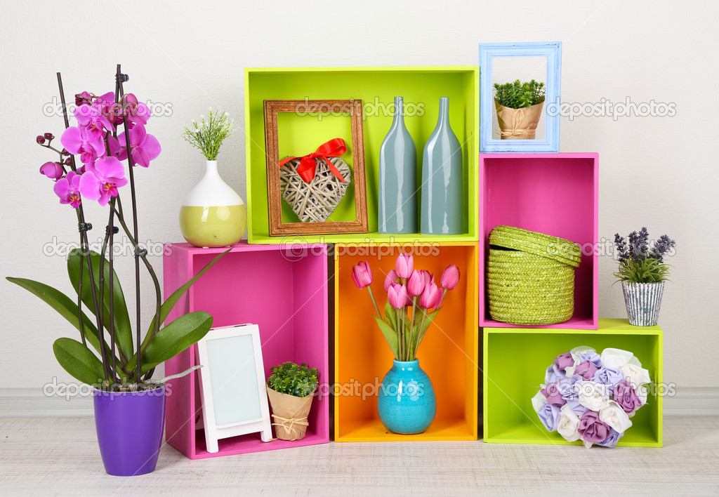 Beautiful colorful shelves with different home related objects