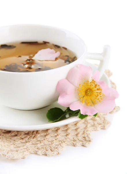 Cup of herbal tea with hip rose flowers, isolated on white — Stock Photo, Image