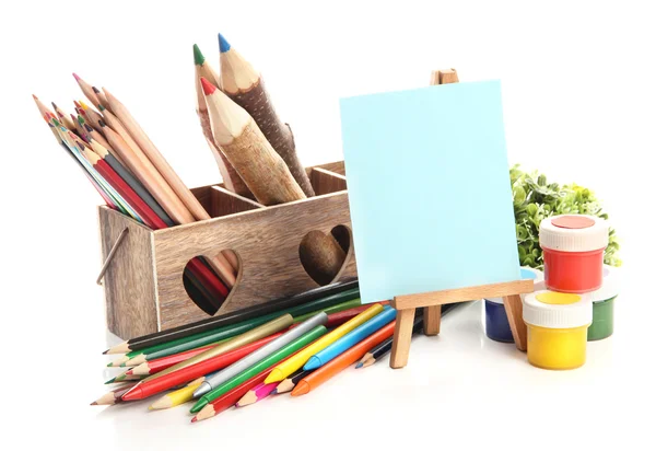 Different pencils in wooden crate, paints and easel, isolated on white — Stock Photo, Image