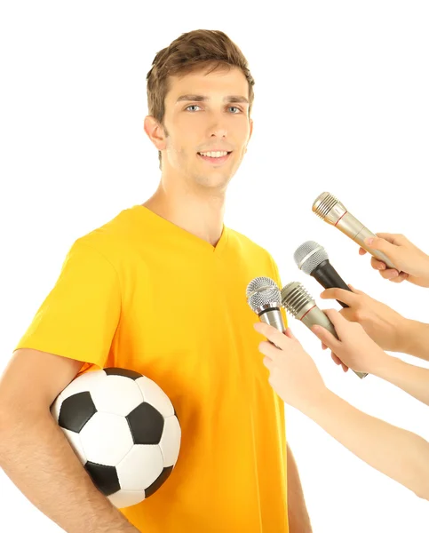 Interview with a young soccer player, isolated on white — ストック写真