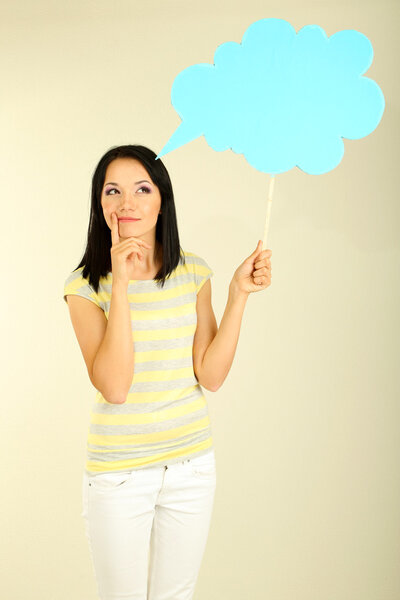 Thought girl in bubble next to it on grey background