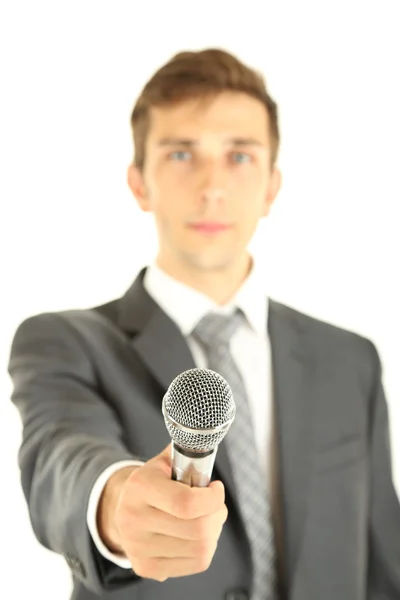 Jeune homme d'affaires parlant avec microphone, isolé sur blanc — Photo