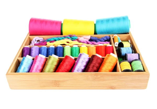 Colorful threads for needlework in wooden box isolated on white — Stock Photo, Image