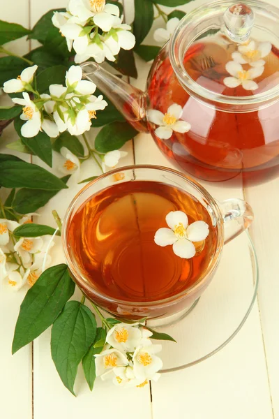 Cup of tea with jasmine, on wooden table, close-up — Stock Photo, Image