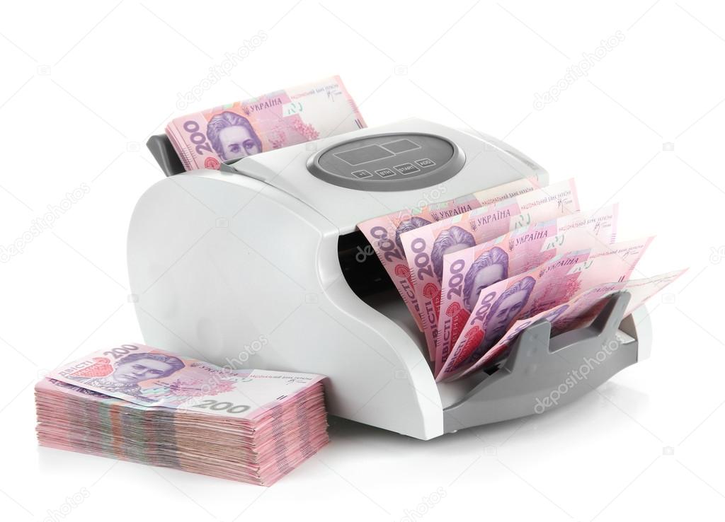 Machine for counting money with Ukrainian money, isolated on white