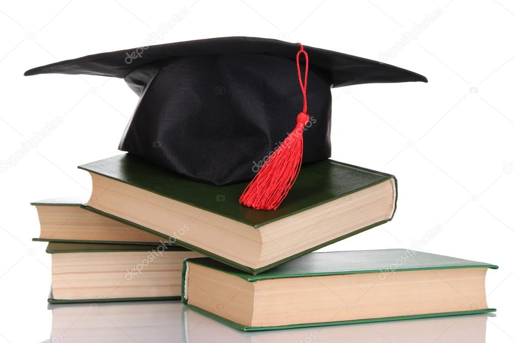 Grad hat with books isolated on white