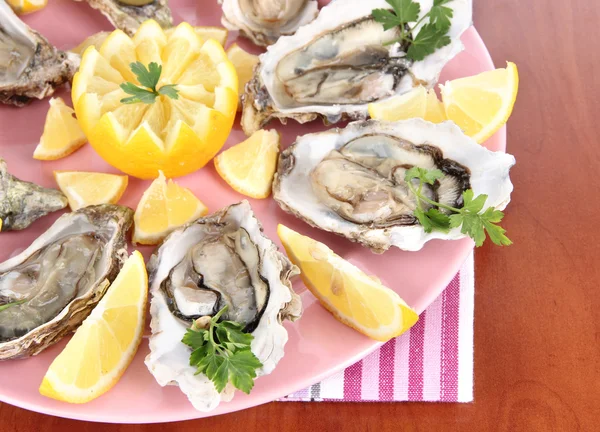 Oysters on wooden background — Stock Photo, Image