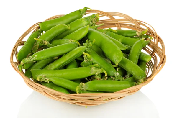 Sweet green peas in wicker basket isolated on white — Stock Photo, Image