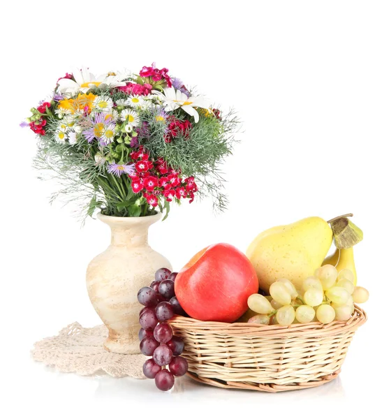 Beautiful bright flowers in vase with fruits isolated on white — Stock Photo, Image