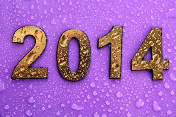2014 in golden numbers, on purple background — Stock Photo, Image