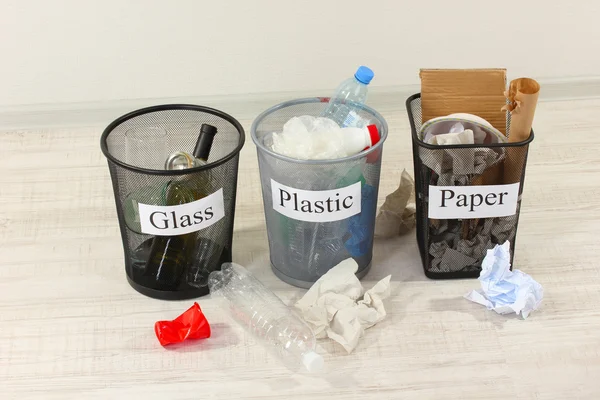 Three buckets of assorted debris on room background — Stock Photo, Image