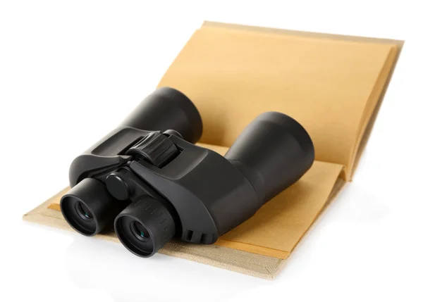 Black modern binoculars with old notebook isolated on white — Stock Photo, Image