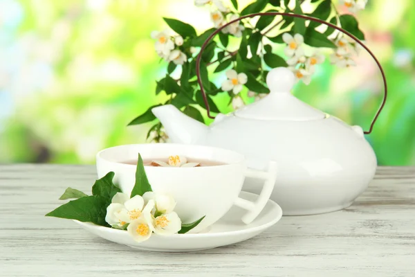 Cup of tea with jasmine, on bright background — Stock Photo, Image