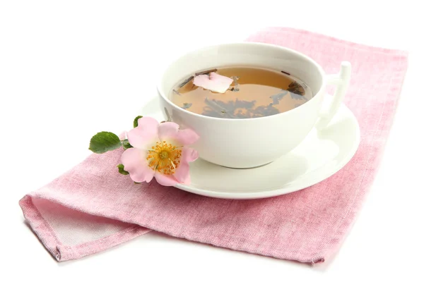 Cup of herbal tea with hip rose flowers, isolated on white — Stock Photo, Image