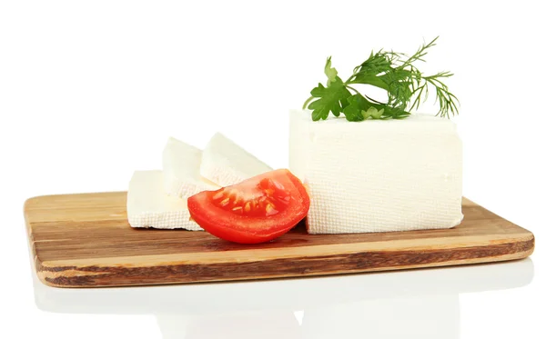Sheep milk cheese, red tomato with parsley and dill on cutting board, isolated on white — Stock Photo, Image