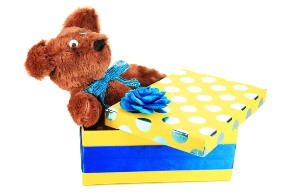 Yellow gift box with toy isolated on white — Stock Photo, Image