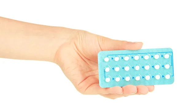 Pastillas hormonales en mano femenina aisladas en blanco — Foto de Stock