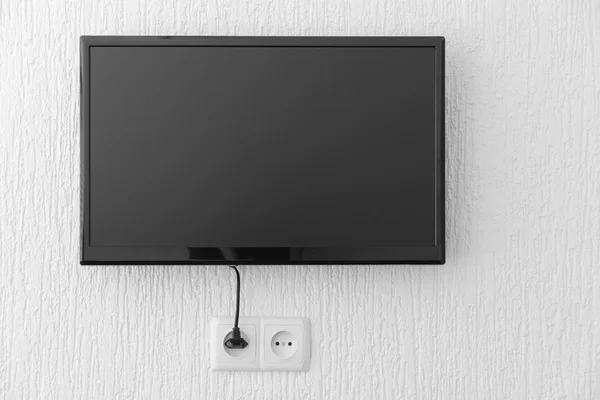 Plasma tv opknoping op de muur — Stockfoto