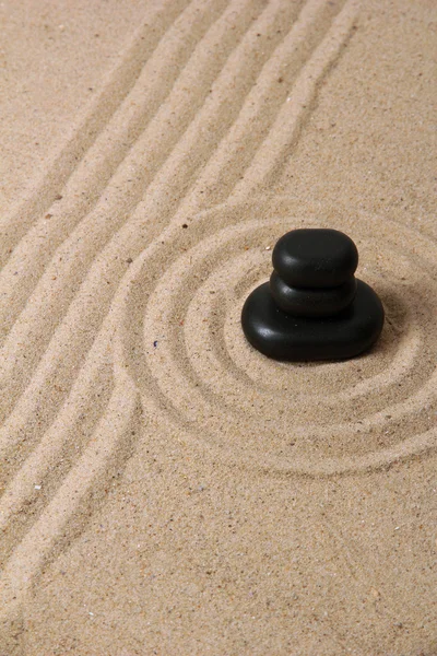 Zen garden with raked sand and round stones close up — Stock Photo, Image