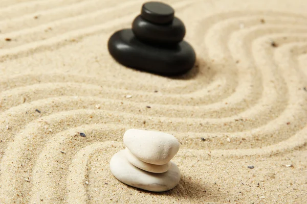 Zen garden with raked sand and round stones close up — Stock Photo, Image