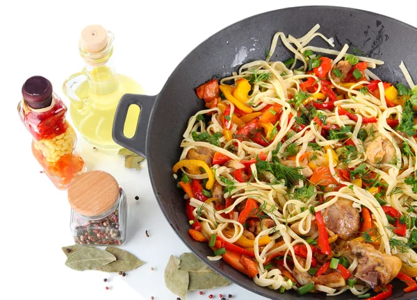 Noodles with vegetables on wok isolated on white — Stock Photo, Image