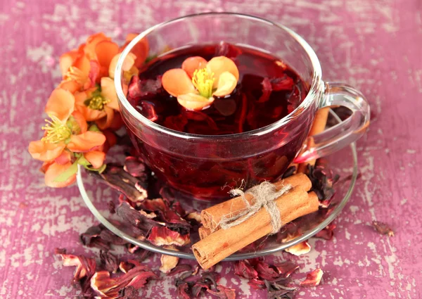 Herbal tea in glass cup, on color wooden background — Stock Photo, Image