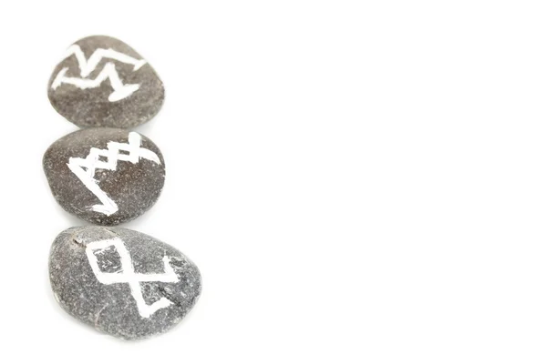 Fortune telling with symbols on stones isolated on white — Stock Photo, Image