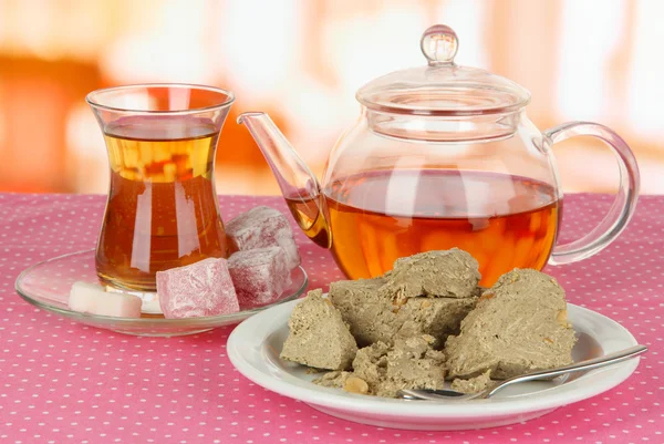 Tasty halva with tea on table in room — Stock Photo, Image